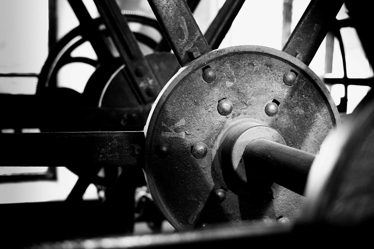 Vintage weight plates and gym equipment showcasing the history of weight training Vintage weight plates and gym equipment showcasing the history of weight training