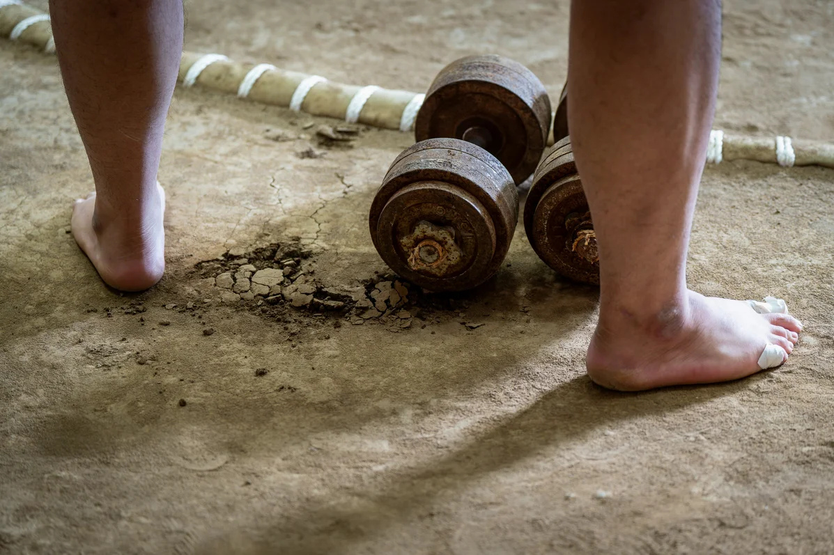 exercise mat and weights on gym floor