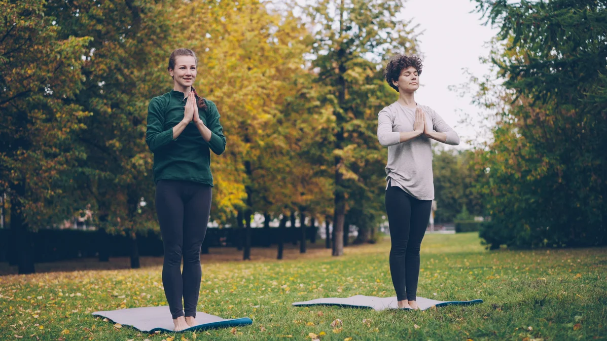 A person exercising outdoors in a green space safely checking air quality index A person exercising outdoors in a green space safely checking air quality index