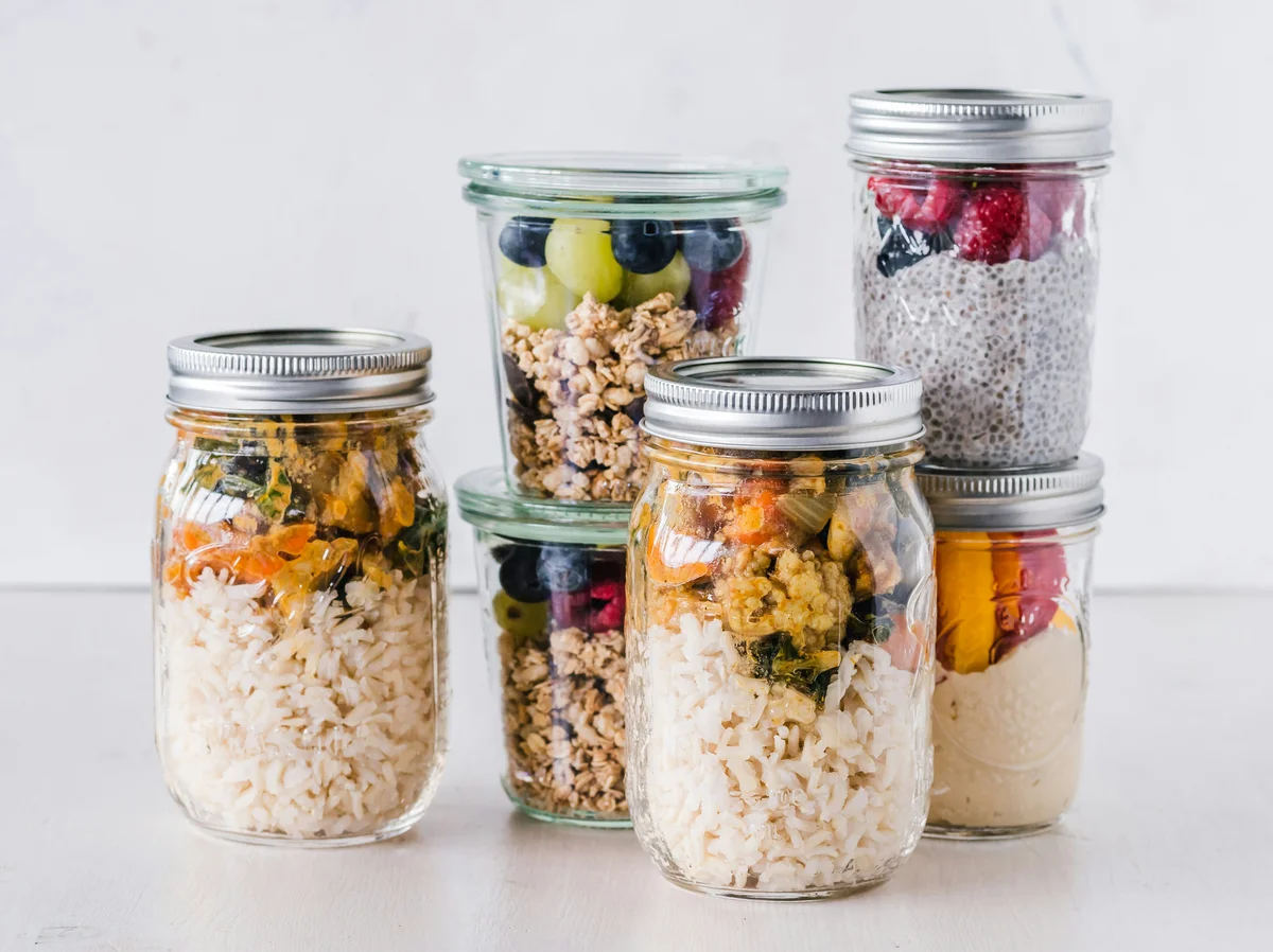 A well-organized meal prep for muscle recovery including eggs, yogurt, and fruits A well-organized meal prep for muscle recovery including eggs, yogurt, and fruits