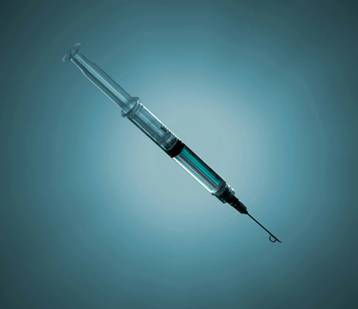 A syringe filled with dermal filler ready for injection