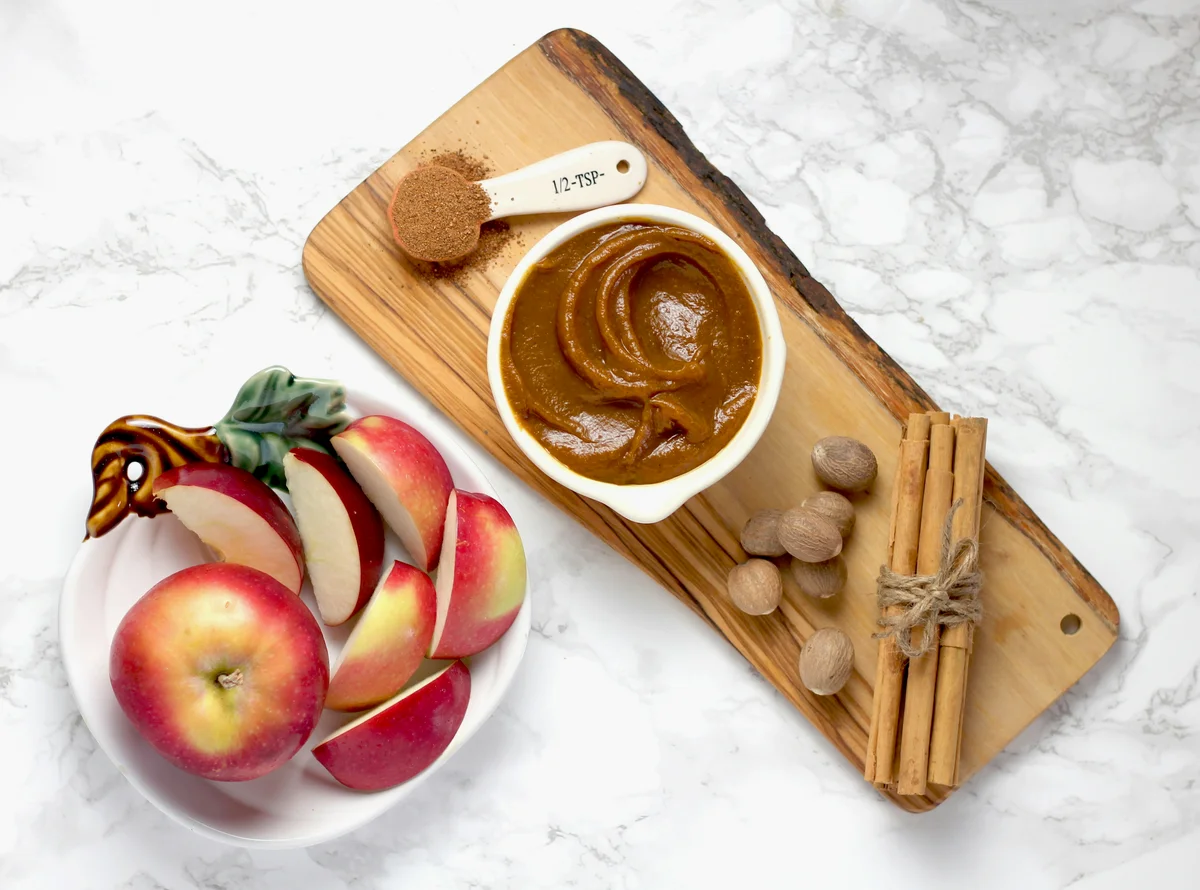 Sliced apples with peanut butter on a plate