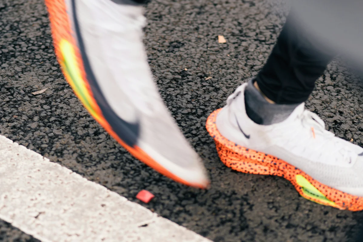 Running shoes and training gear, representing practical lessons for everyday runners