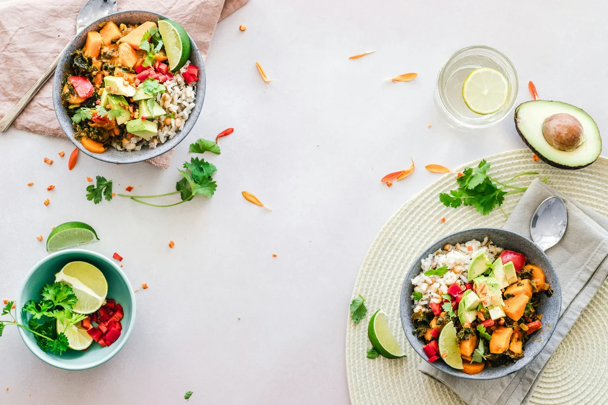 colorful healthy meal prep bowls filled with vegetables and protein