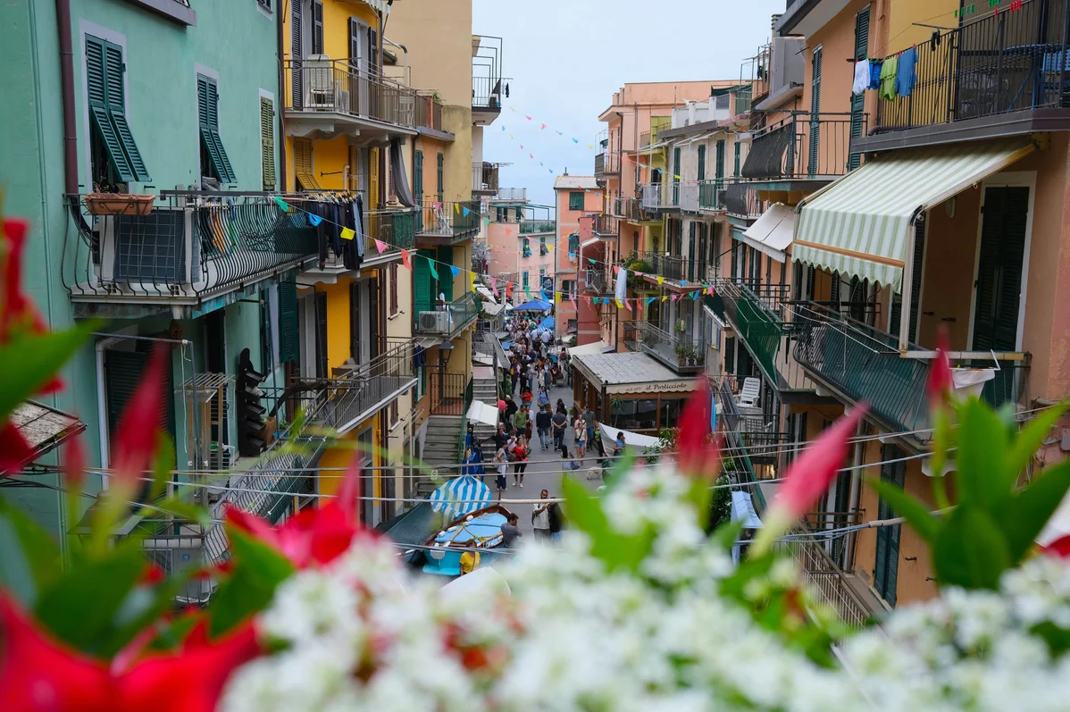 An Italian village market filled with fresh fruits and vegetables An Italian village market filled with fresh fruits and vegetables