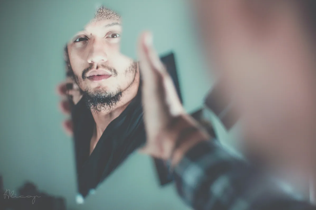 man checking grooming in the mirror man checking grooming in the mirror