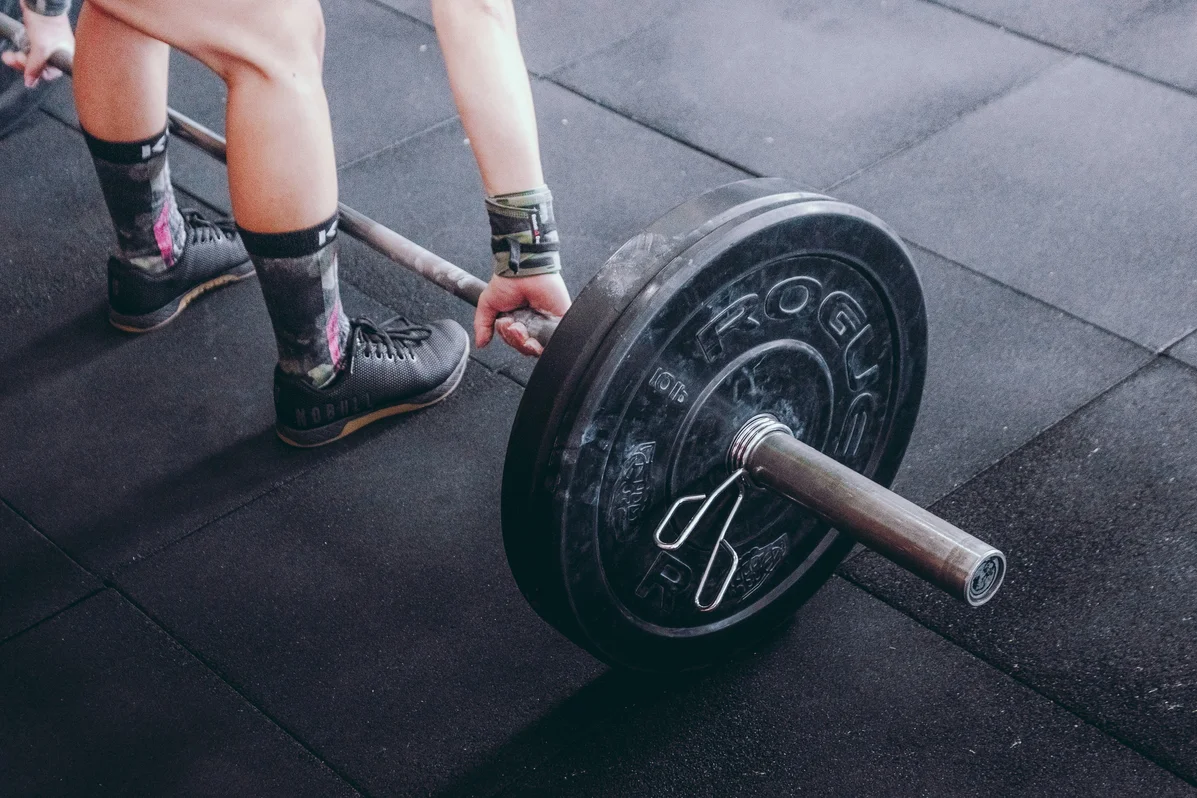 A close-up of a person gripping a barbell for strength training A close-up of a person gripping a barbell for strength training