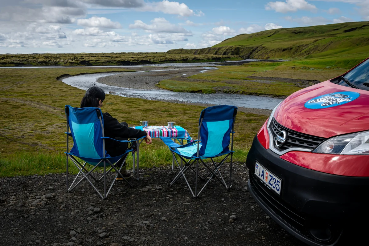 A can of sardines on a table in a scenic outdoor setting