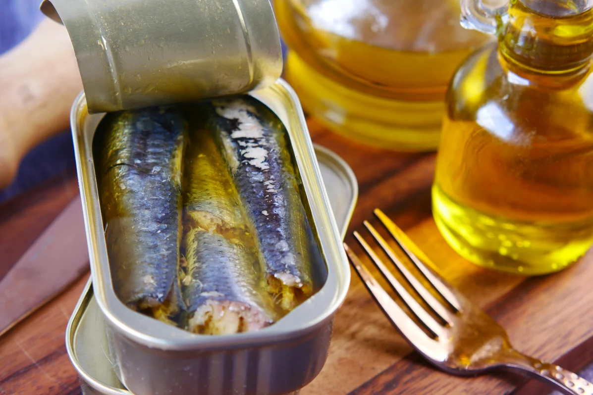 A delicious meal featuring sardines with vegetables and grains