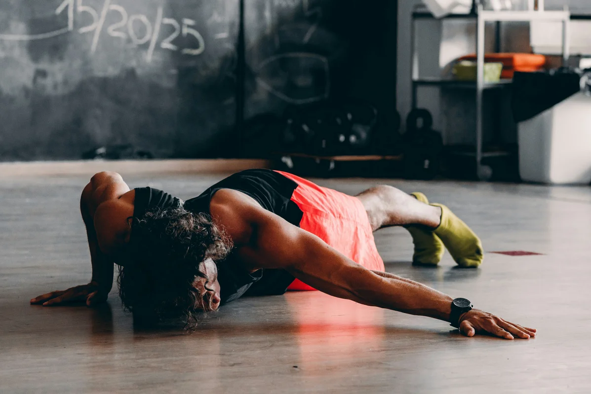 A runner performing a core exercise to enhance stability and prevent side stitches A runner performing a core exercise to enhance stability and prevent side stitches