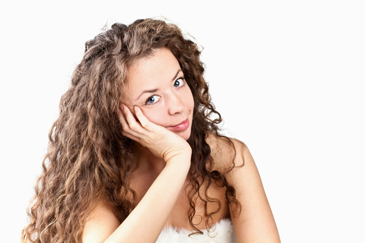 Close-up of thinning hair and brittle nails as signs of protein deficiency