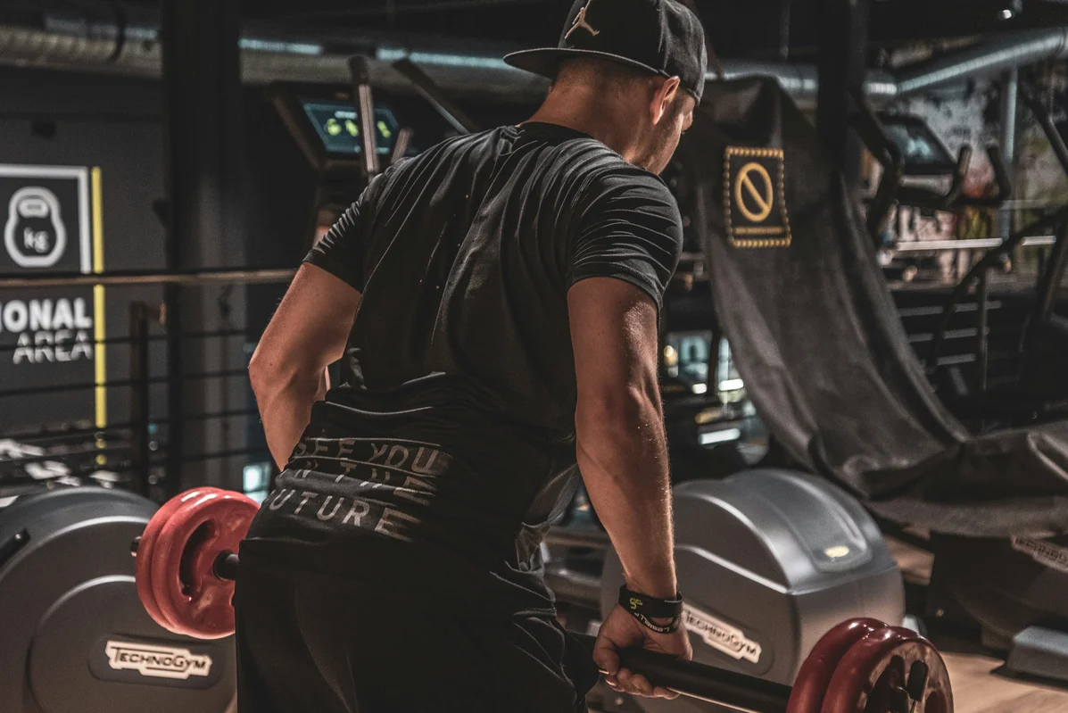 Gym equipment used for single-leg deadlifts, including dumbbells