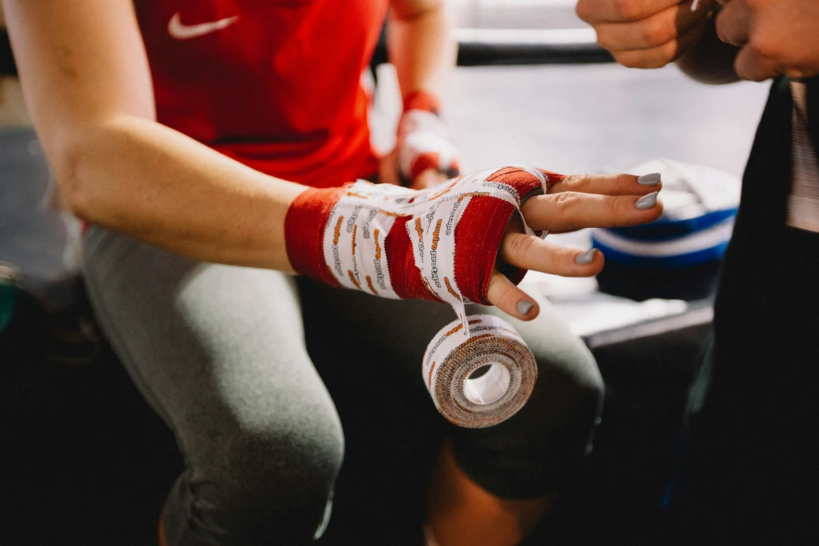 Close-up of hands gripping a barbell during a lift